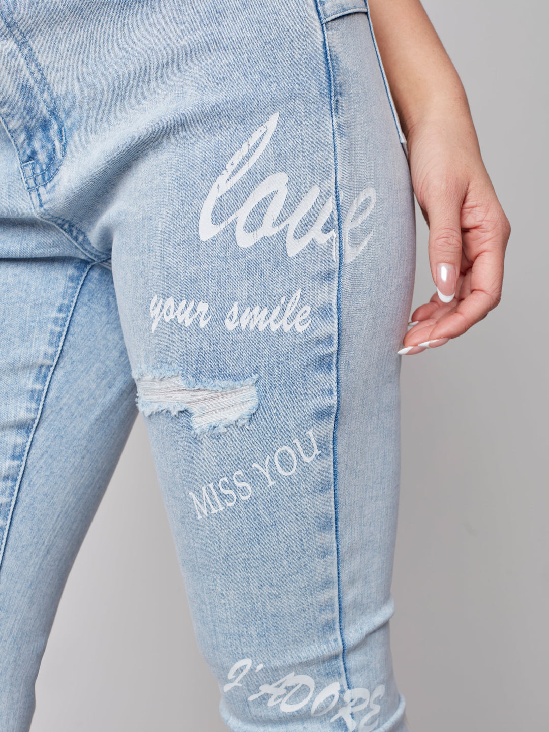 Mid Rise Distressed Skinny Jean